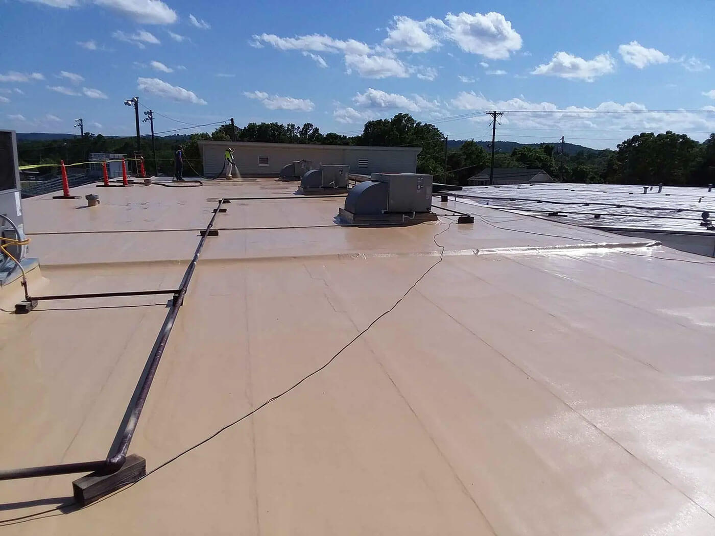 Freshly coated flat commercial roof with polyurea in Arkansas