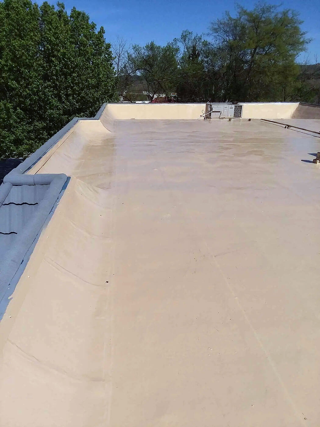 Commercial flat roof restoration with polyurea coating — project 8